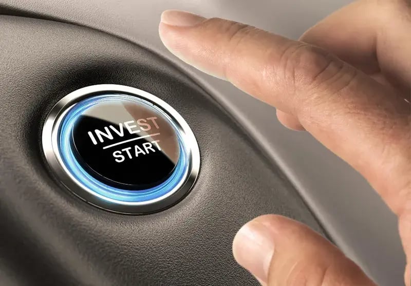 a finger about to press a button that reads "invest/start"