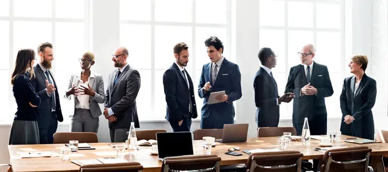 board of directors standing in discussion