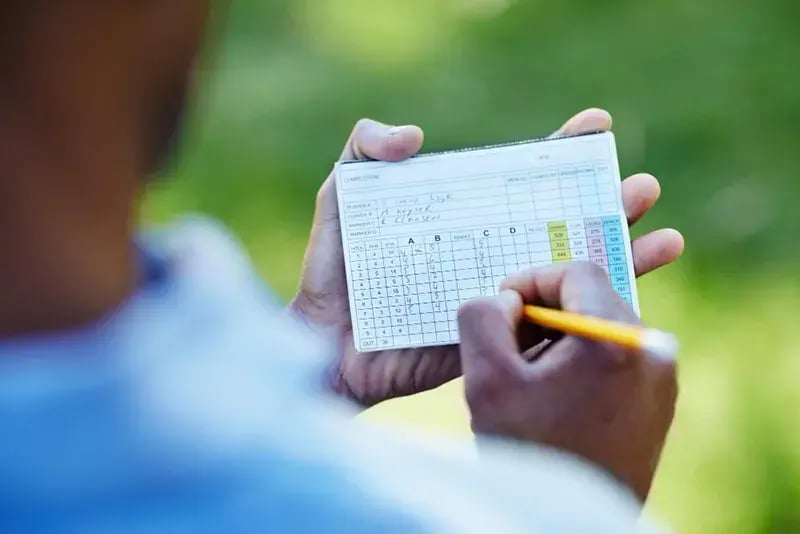 filling out a score card