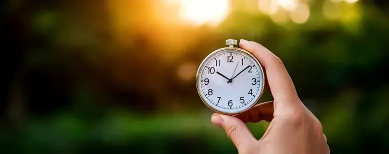hand holding stopwatch
