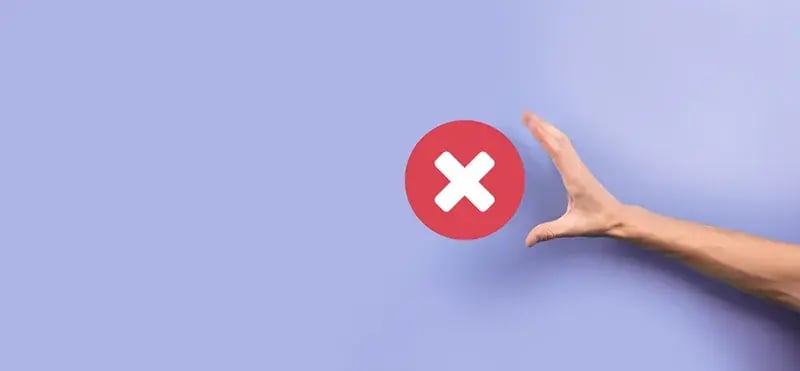 hand reaching for an X