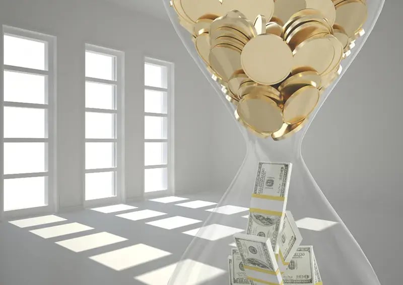 hourglass filled with money and gold coins