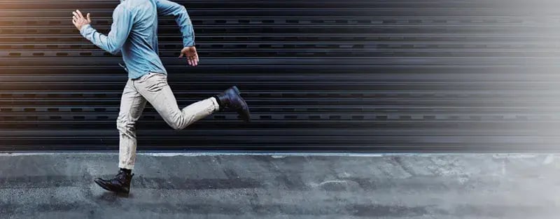 man running down the street