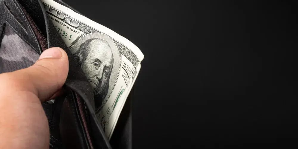 pulling money from a wallet